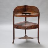 A Georgian mahogany corner wash stand with raised back fitted 3 bowl recepticals the base fitted a