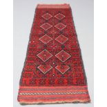 A blue and red ground Meshwani runner with 9 diamonds to the centre 238cm x 63cm