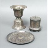 A "Persian" engraved metal bell shaped vase 15cm h x 11cm together with a cylindrical jar and
