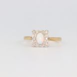 An Edwardian yellow metal opal and diamond square ring, the centre stone 0.5ct, size N, 2 grams