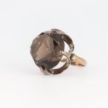 A Chinese yellow metal circular smoky quartz ring 7.5 grams, size J