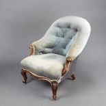 A Victorian armchair with metal frame upholstered in blue material on cabriole supports 84cm h x