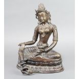 A bronze figure of a seated Goddess 31cm h x 23cm w x 17cm d