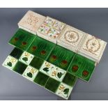 Four Art Nouveau tiles decorated with stylised flowers (1 chipped) and 3 similar (all chipped), 11