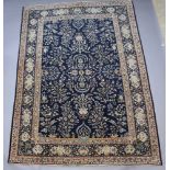 A blue and white ground North West Persian carpet decorated flowers, birds and deer 359cm x 261cm