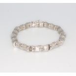 A white metal stamped 750, bamboo effect bracelet, 21.5 grams, 19cm