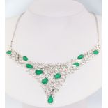 A white metal stamped 14k emerald and diamond necklace set with 9 pear cut emeralds approx. 6ct