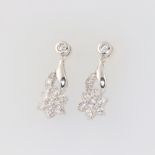 A pair of 18ct white gold daisy style drop earrings, the diamonds approx. 1.3ct, each earring