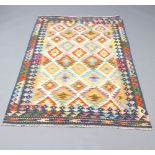 A black, white and tan ground Chobi rug 194cm x 120cm