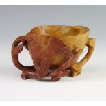 A late 19th Century carved soapstone libation cup with leaf handle 11cm