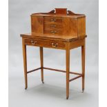 An Edwardian inlaid mahogany writing table, the upper section with shaped back fitted 3 drawers