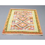 A green, brown and orange ground Chobi rug with 3 diamonds to the centre within a multi row border