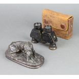 A bronzed figure of a reclining hound 5cm x 15cm x 7cm together with a pair of Negretti & Zambra