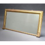 A Regency rectangular plate over mantel mirror contained in a gilt frame with columns to the