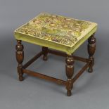 A 17th Century style beech stool the seat with Berlin wool work panel decorated a tree and