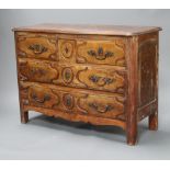 An 18th/19th Century Continental elm chest of serpentine outline fitted 2 short and 2 long