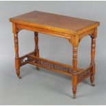 A late Victorian rectangular walnut card table raised on turned supports with pierced stretcher 75cm