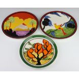A Wedgwood, Clarice Cliff Bizarre plate Orange Erin 2271A/9500 26cm, a ditto Bird of Paradise 354/