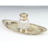 An Edwardian silver elliptical ink stand with silver mounted cut glass inkwell Sheffield 1903 24cm