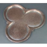 A Persian engraved copper clover shaped tray 39cm x 43cm