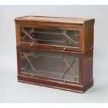 A mahogany Globe Wernicke style 2 tier bookcase enclosed by astragal glazed panelled doors, raised