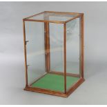 A 19th Century mahogany shop display cabinet enclosed by a glazed panelled door 76cm h x 51cm w x