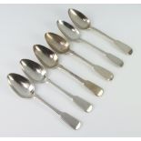 A matched set of 6 silver fiddle pattern dessert spoons London 1823 and 1827, 296 grams