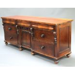 A Victorian mahogany sideboard fitted 3 secret drawers above cupboard enclosed by a panelled door,