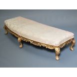 A large and impressive Empire style window seat/stool with overstuffed seat raised on cabriole