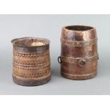 Two Eastern circular wooden and metal mounted vases/barrells 20cm h x 14cm diam. and 16cm x 15cm