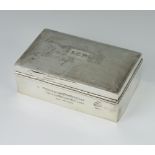 A rectangular silver engine turned cigarette box with inscription and monogram, Birmingham 1930,