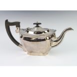 An octagonal silver teapot with ebony mounts, gross weight 704 grams, Sheffield 1921