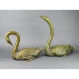 A pair of bronze figures of swans 33cm x 40cm x 23cm and 30cm x 20cm x 35cm