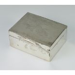A rectangular silver engine turned cigarette box 11cm x 5cm