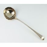 A George III silver ladle with bright cut decoration and engraved monogram London 1771, 142 grams
