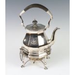 A Victorian octagonal silver plated tea kettle on stand with burner, ebony mounts and crest