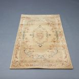 An Abbey cream ground and floral patterned Aubusson style hearth rug 160cm x 84cm