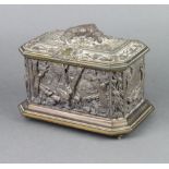 A 19th Century gilt metal lozenge shaped casket with hinged lid, the top decorated a seated hound,