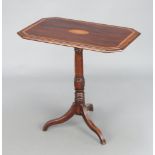 An Edwardian inlaid mahogany lozenge shaped wine table, the top inlaid a shell, raised on a turned