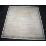 A mushroom and green ground Nepalese hand knotted carpet with green Grecian key decoration to the