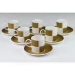 Six Susie Cooper coffee cans and saucers Heraldry Old Gold C2112