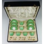 A set of 6 Royal Worcester coffee cups and saucers with pale green and gilt decoration, together