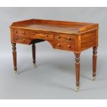 A Gillows style mahogany dressing table with three quarter gallery, fitted 1 long and 4 short