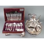 A silver plated 4 piece demi-fluted tea set, cased canteen, tray and ladle
