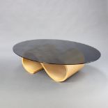 A Mid-Century S shaped plywood base and oval smoked plate glass topped coffee table 40cm h x 118cm x