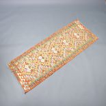 A tan, green and yellow ground Chobi runner with 5 diamonds to the centre 187cm x 67cm