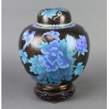 A Chinese black and blue enamelled cloisonne jar and cover with hardwood stand 22cm x 20cm