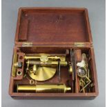 A 19th Century gilt metal single pillar student's field microscope 26cm h x 8cm, contained in a