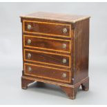 An Edwardian style inlaid mahogany chest of 4 long drawers with canted reeded corners, raised on