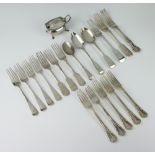 A quantity of silver cutlery, spoons and forks including a cruet, mixed dates, gross weight 1000